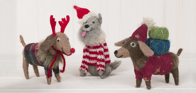 Set of 3 felt dogs in festive attire.
