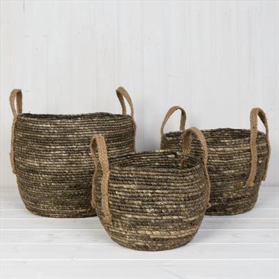 Set of three dark seagrass baskets with ear handles detail page