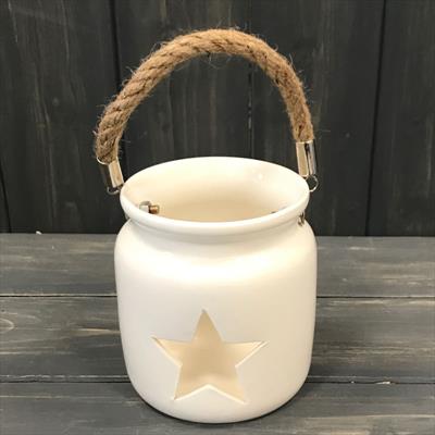 Ceramic tealight with star pattern cut out